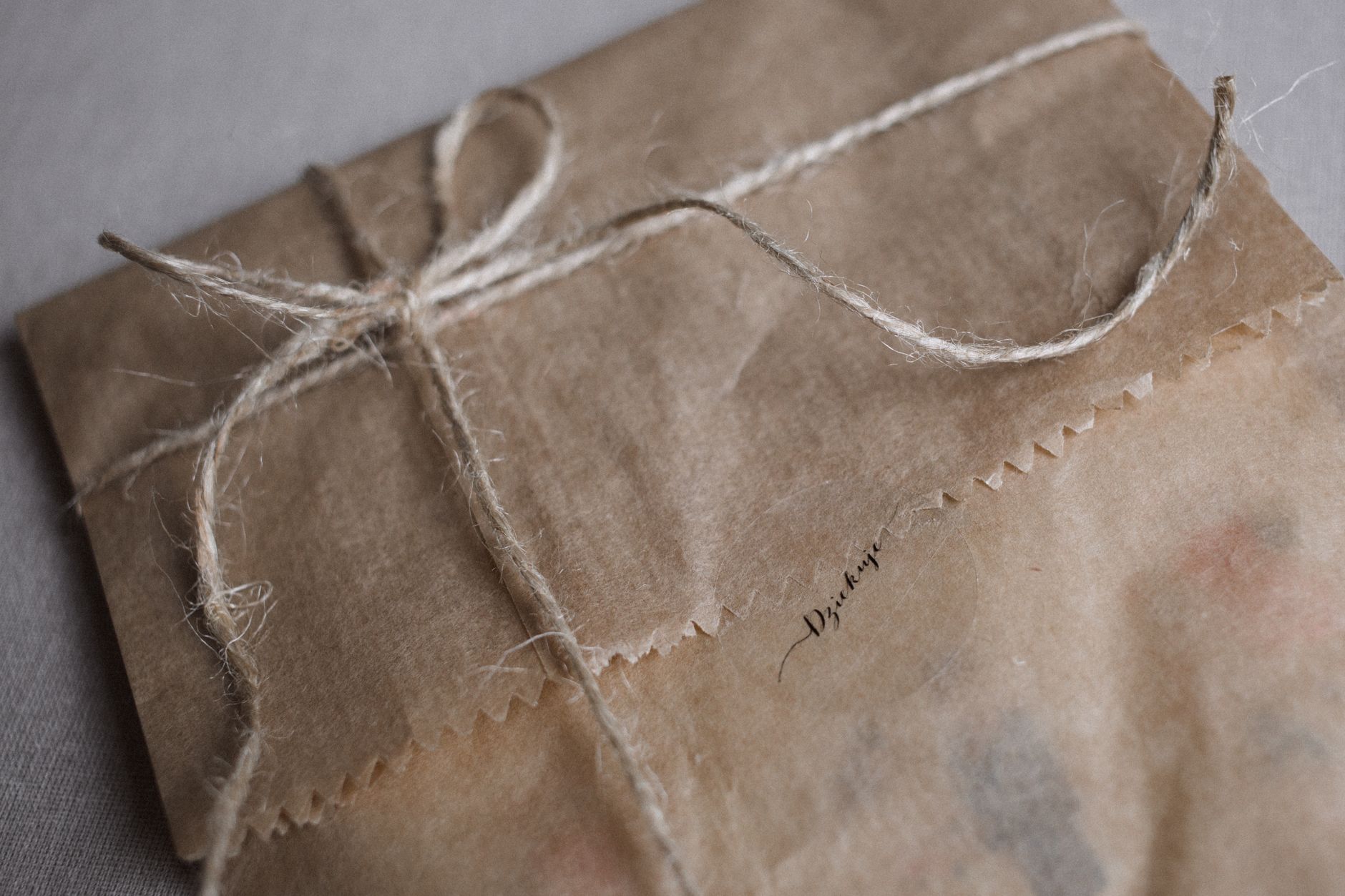 Kraft-wrapped parcel tied with string